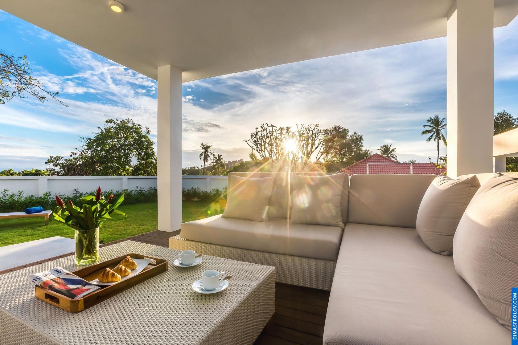 Hotel terrace lounge: comfortable seating with scenic ocean and sunset views