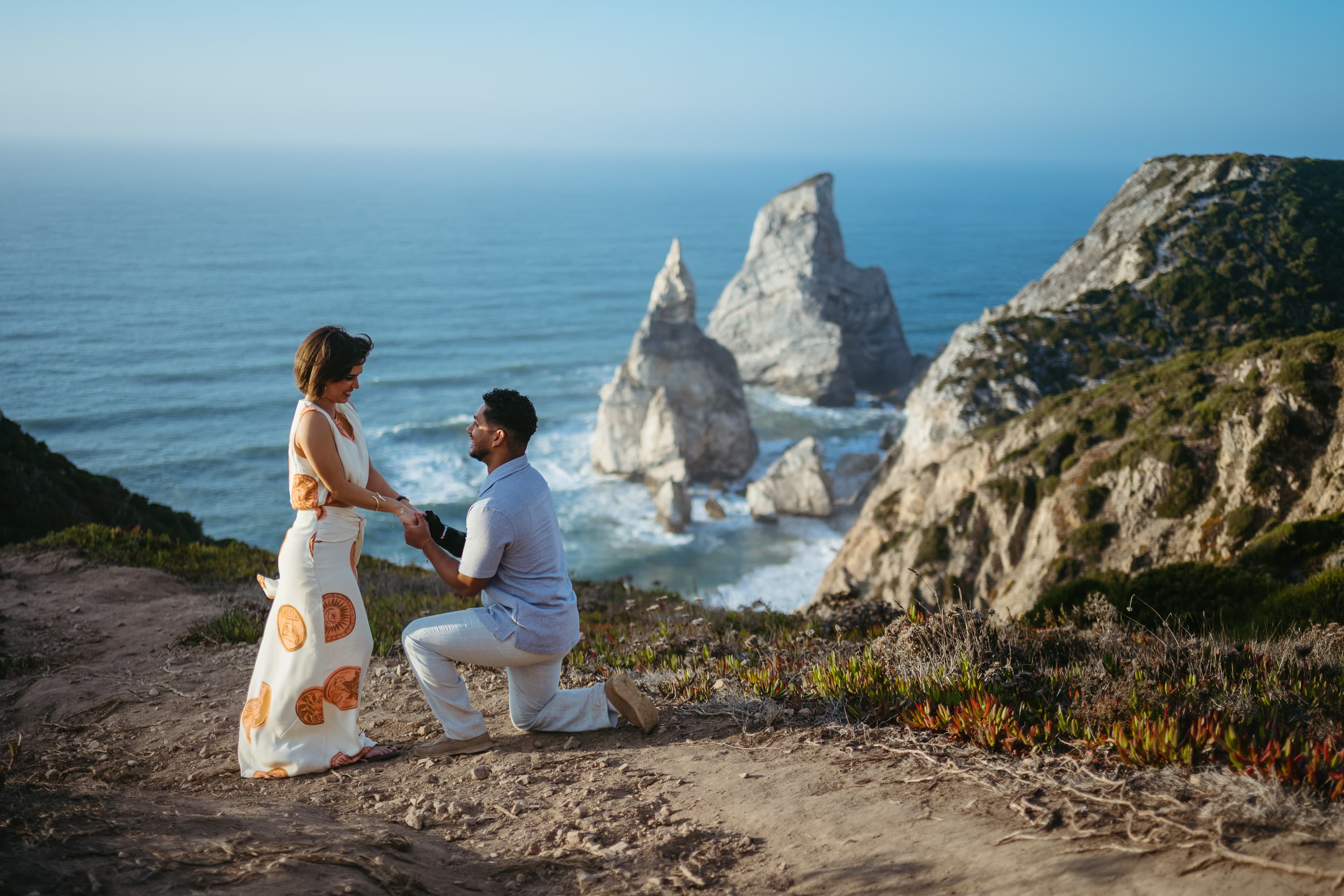 Marriage proposal on the cliffs above Praia da Ursa on the Atlantic coast near Lisbon