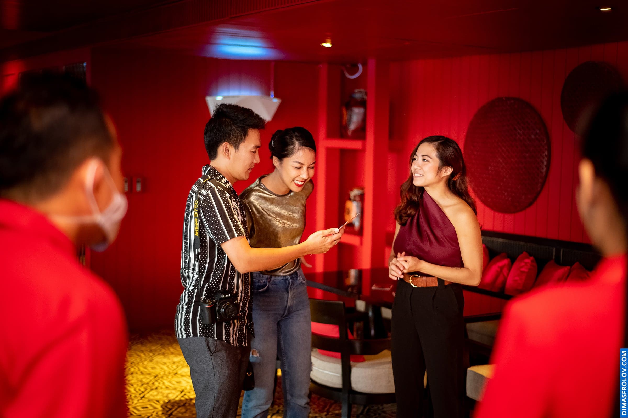 Lively party at stylish bar — people toasting and enjoying the evening